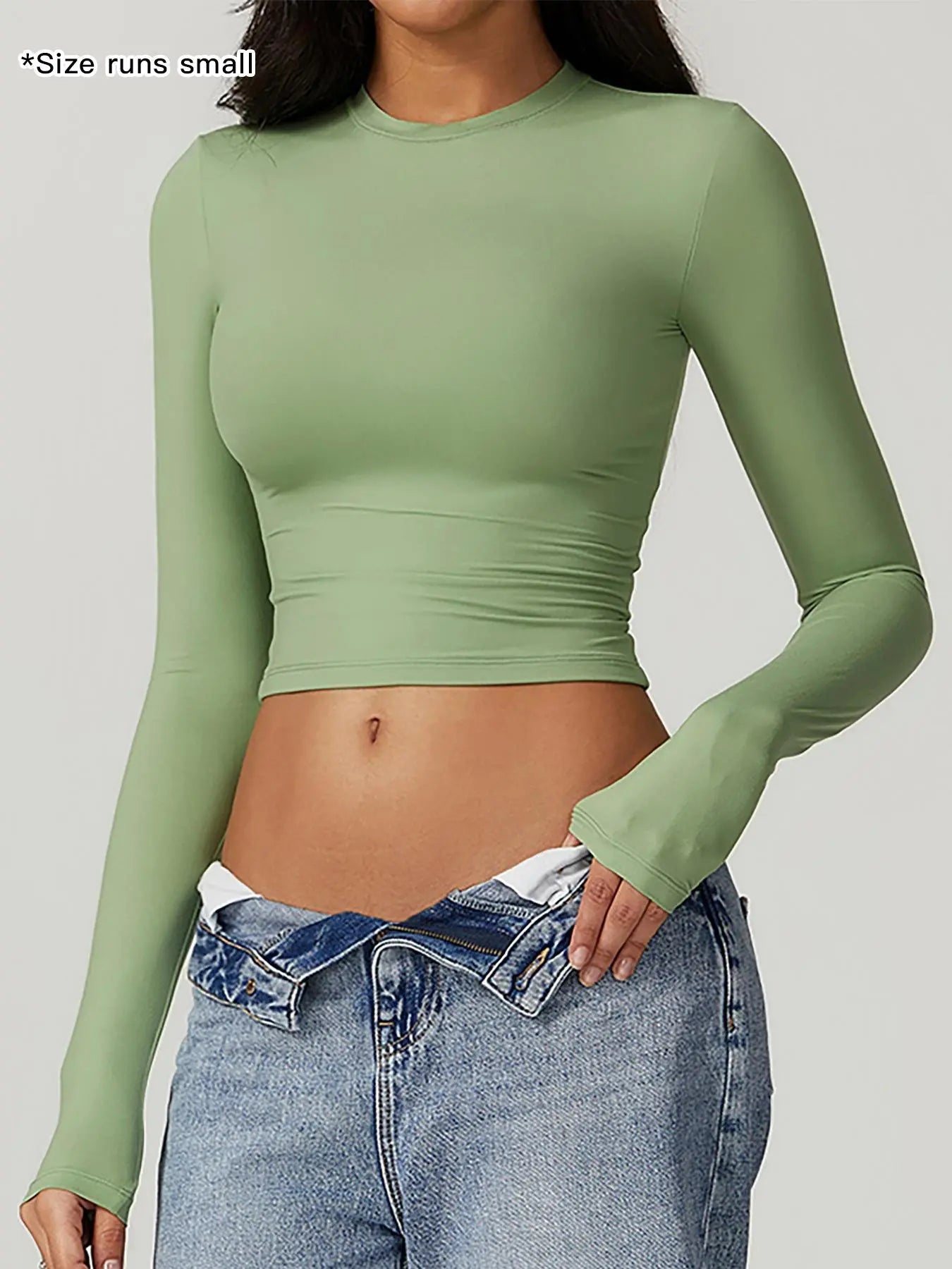 T-shirt de sport à col rond uni et compressif pour femme