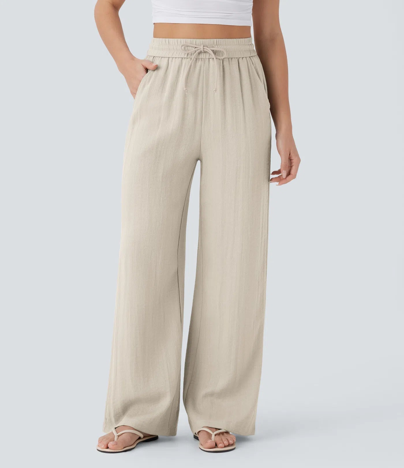 Pantalon ample taille haute en lin avec cordon de serrage et grandes poches